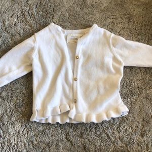 White cardigan with gold buttons